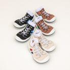 Six baby shoe socks in various colors.