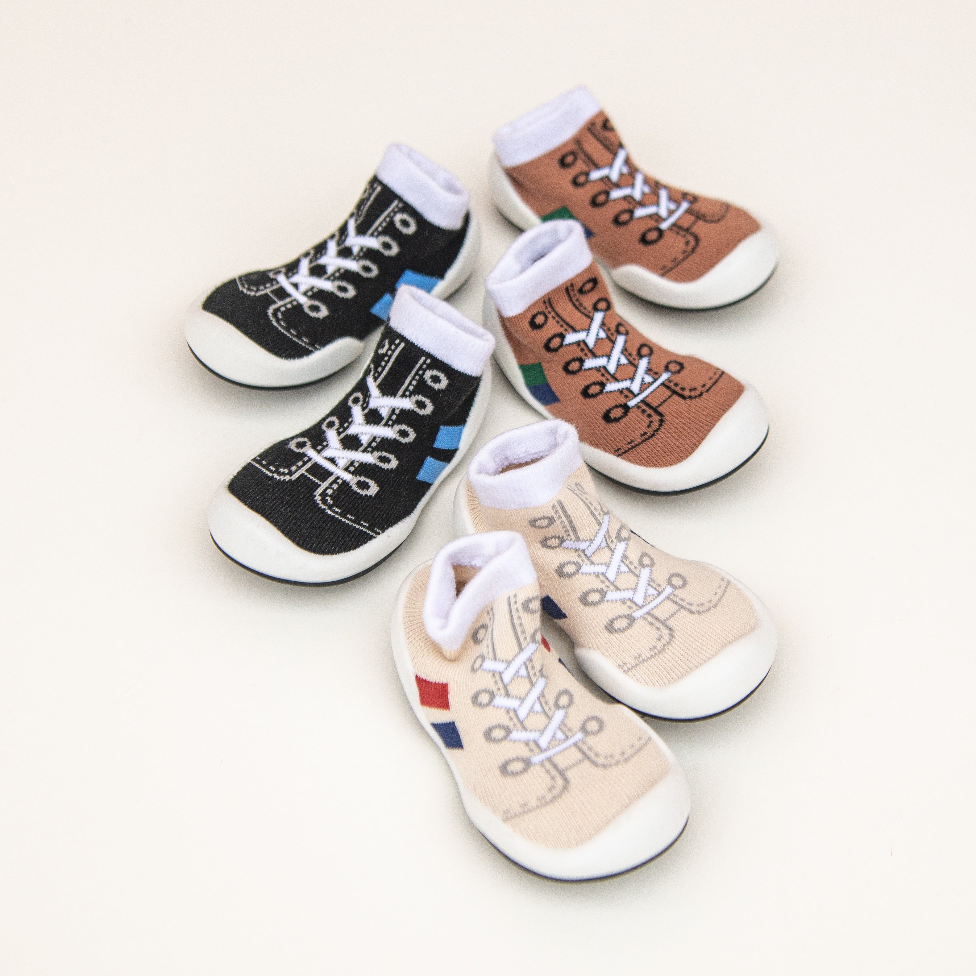 Six baby shoe socks in various colors.