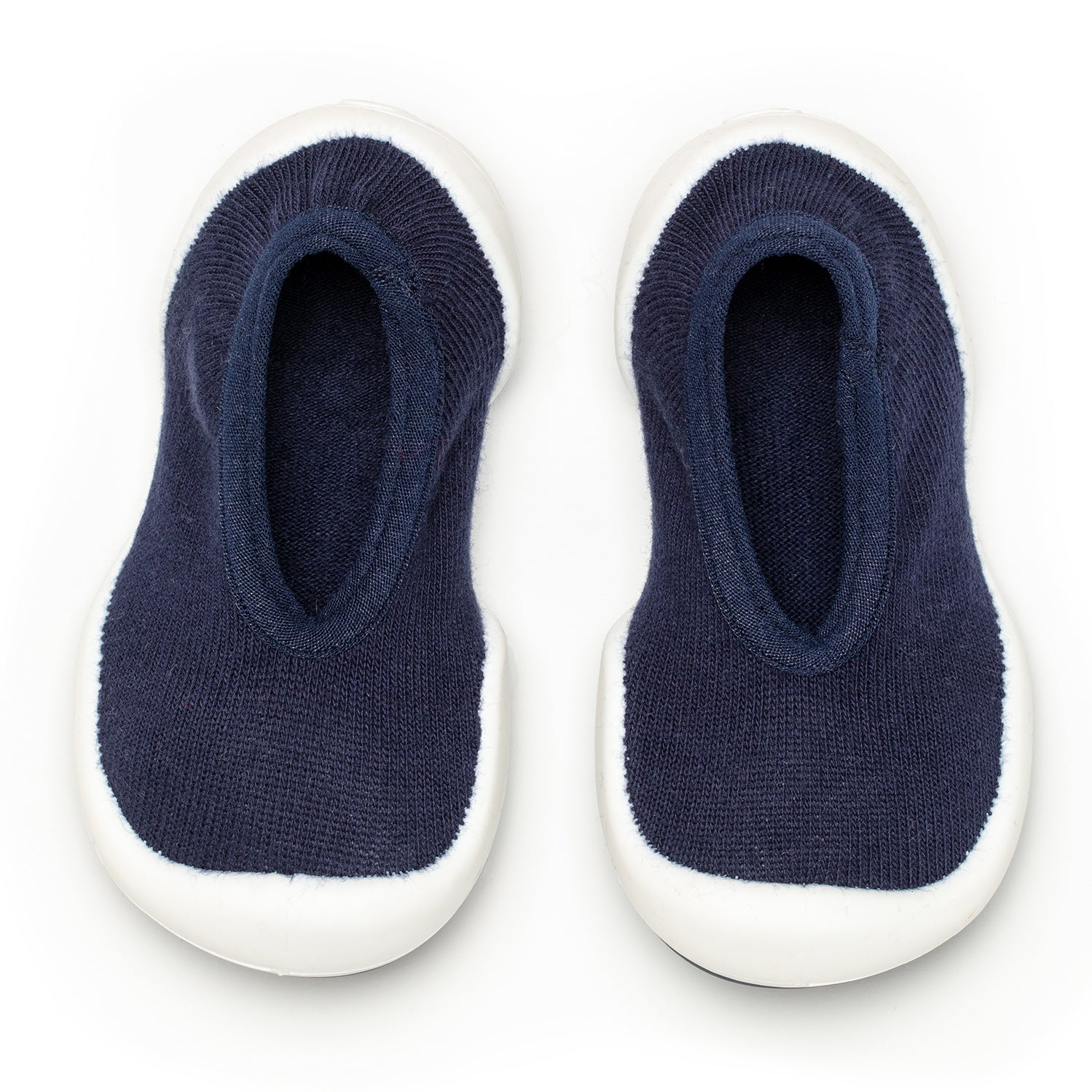 Two navy blue sock shoes with white soles.