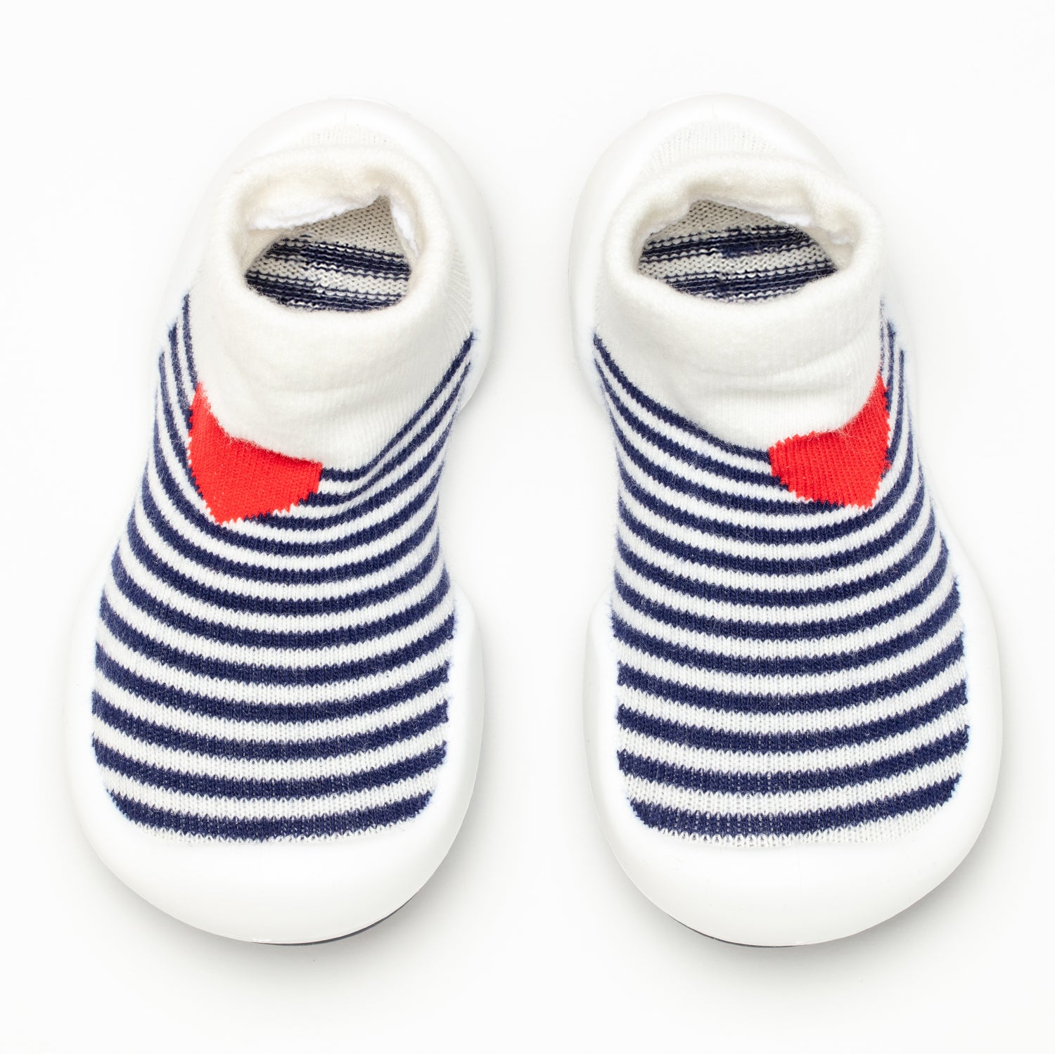 A pair of striped baby shoes with a red heart detail.