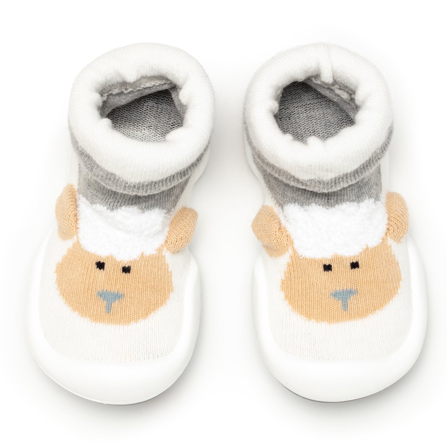 Pair of white baby booties with sheep design.