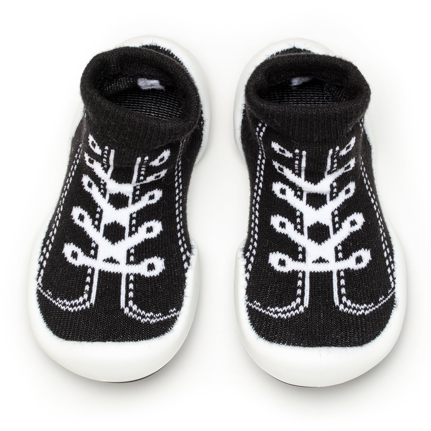 Pair of black and white baby shoe socks with rubber soles.