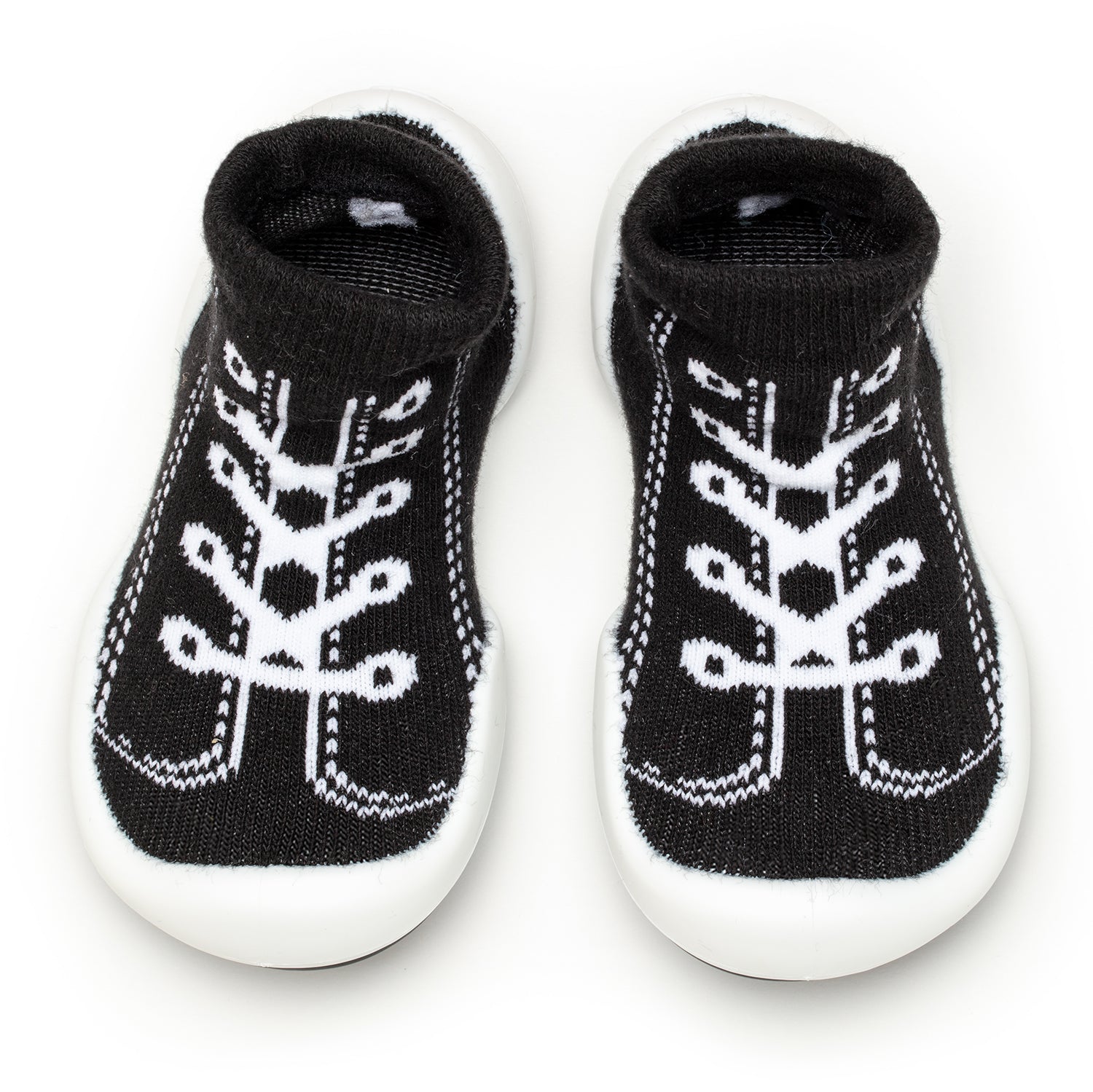 Pair of black and white baby shoe socks with rubber soles.