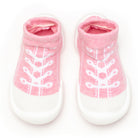Pair of pink and white baby sock shoes.