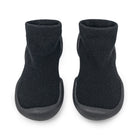 Two black slipper socks with ribbed ankles and rubber soles.