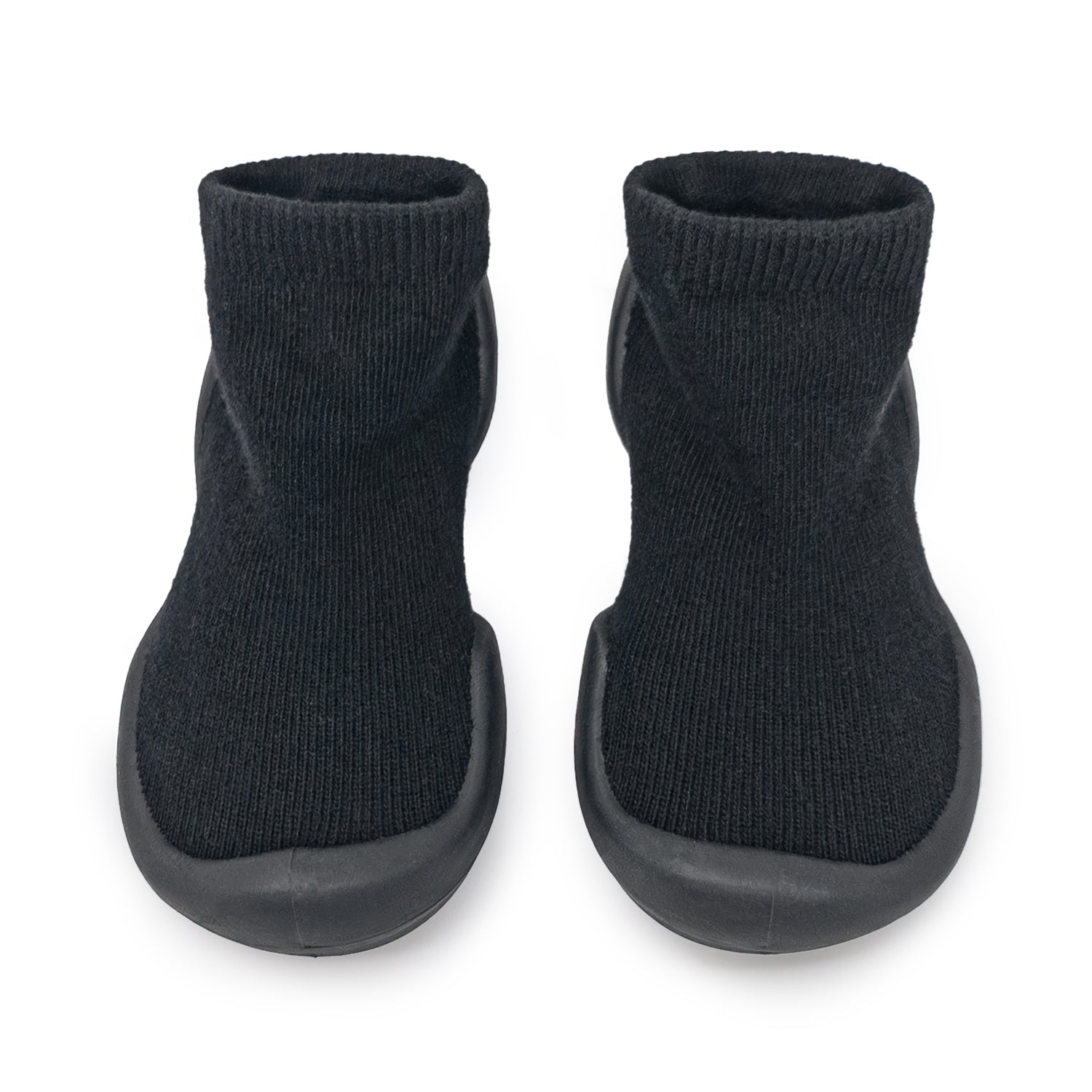 Two black slipper socks with ribbed ankles and rubber soles.