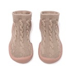 Two beige cable knit sock shoes with rubber soles.