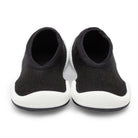 Pair of black and white baby shoes.