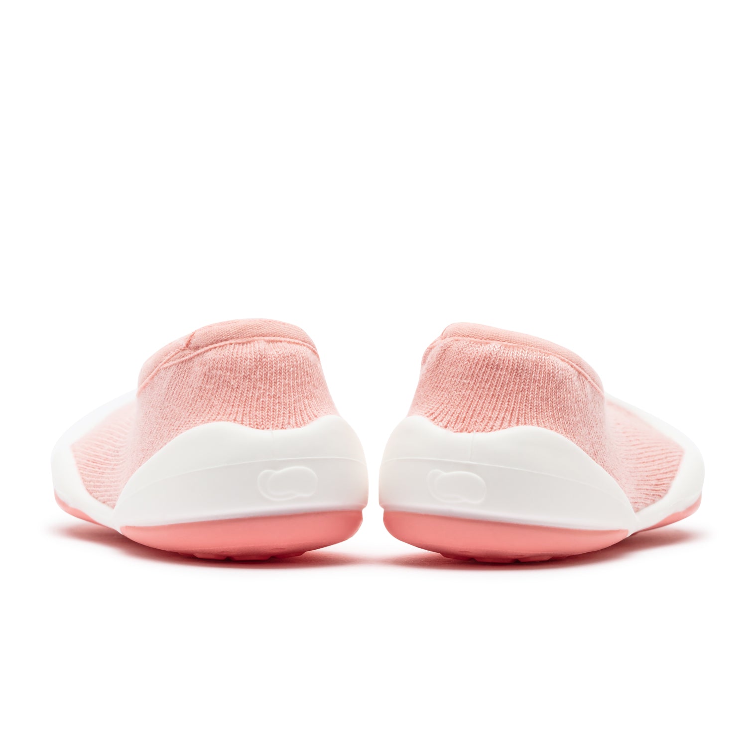 Two pink and white baby shoes from the back.