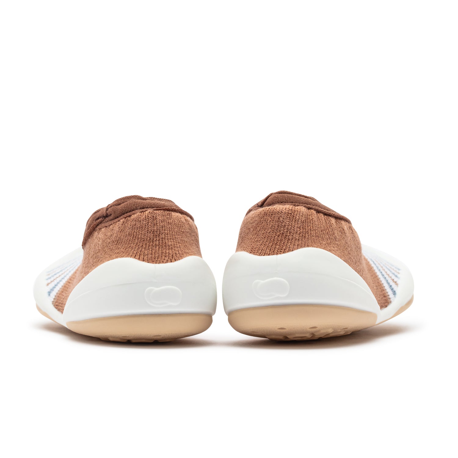 Back view of two baby shoes, brown and white.