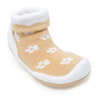 Tan and white sock shoe with flower pattern.