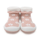 Pair of pink baby shoe socks with white flower pattern.