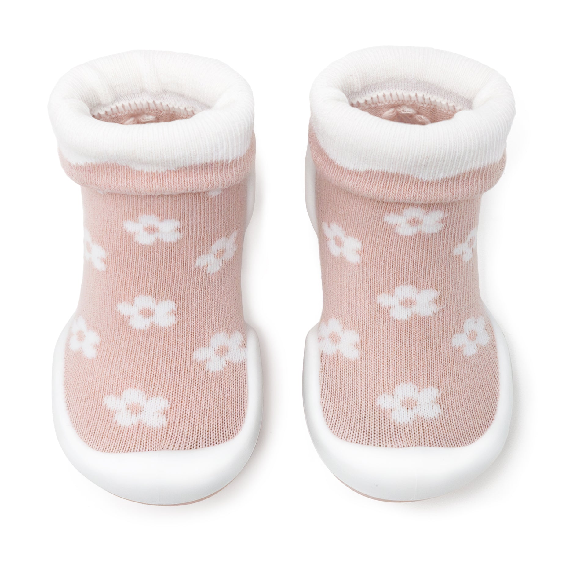 Pair of pink sock shoes with white floral pattern and white trim.