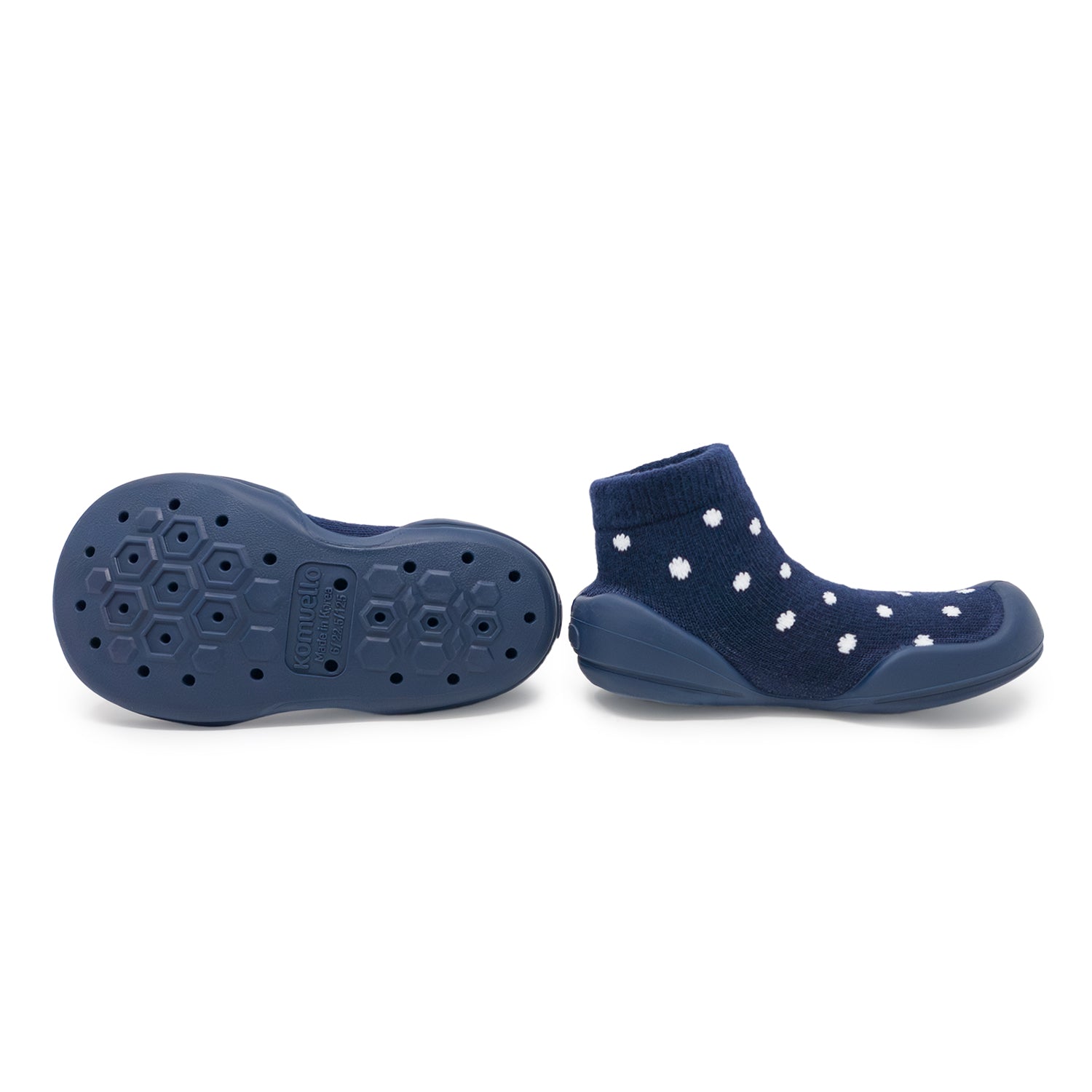 Two blue baby shoes with white polka dots.