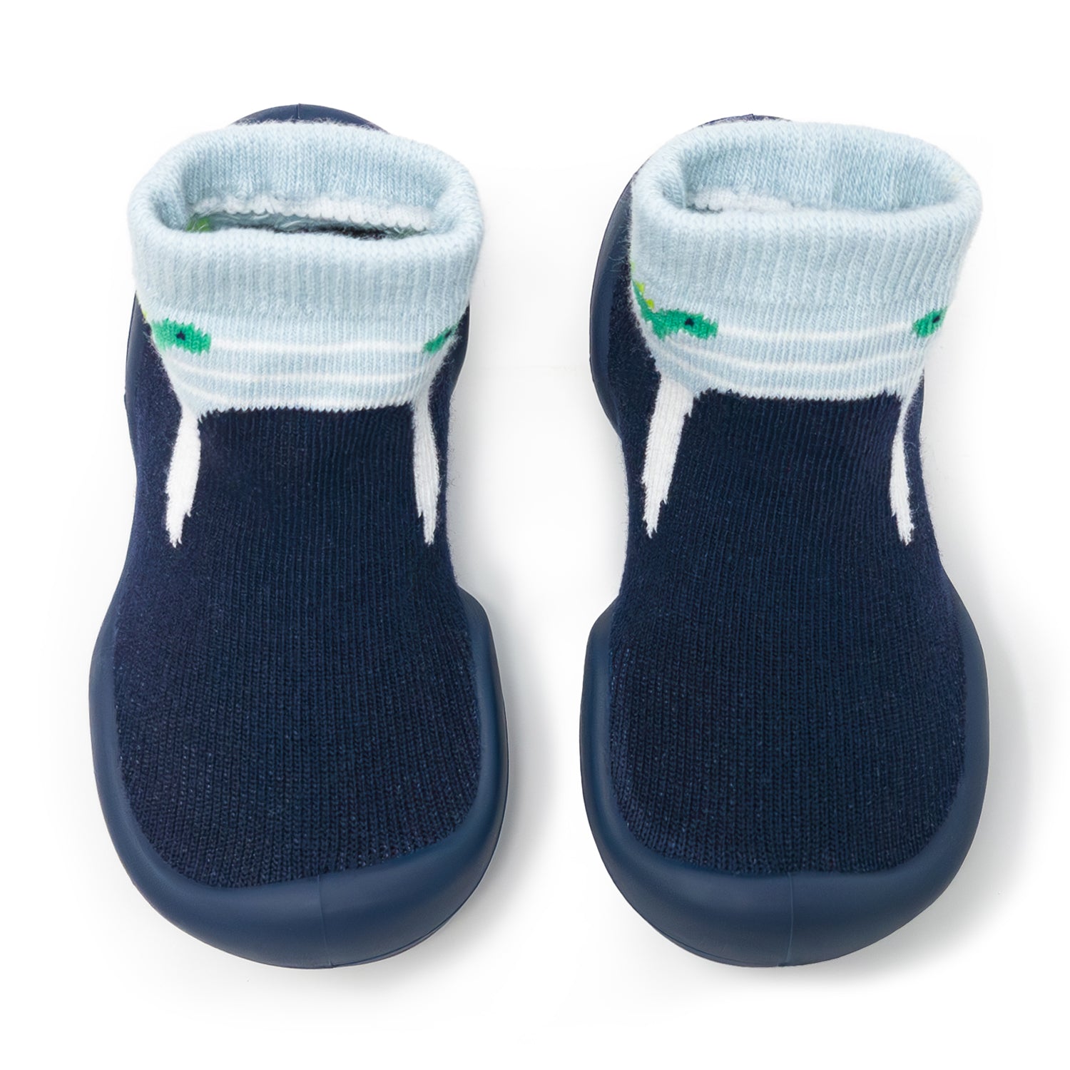 Two navy blue baby socks with light blue cuffs and white stripes, featuring a green alligator pattern.