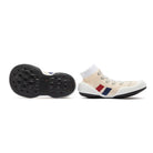 Two sock sneakers, one sole up and one on its side.
