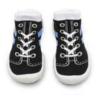 Two black and white baby sock-shoes.