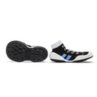 A pair of black and white baby sock shoes with blue accents.