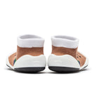 Pair of baby socks with brown knit, white tops, and white and black soles.