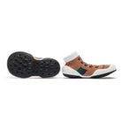 Two brown sock shoes, one with a black sole facing up.