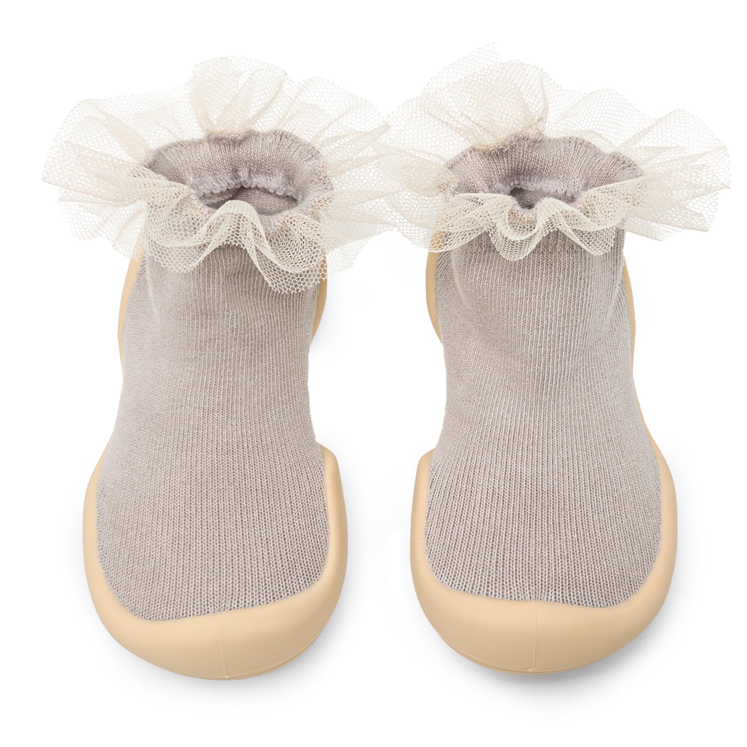 Pair of gray socks with beige rubber soles and white tulle trim.