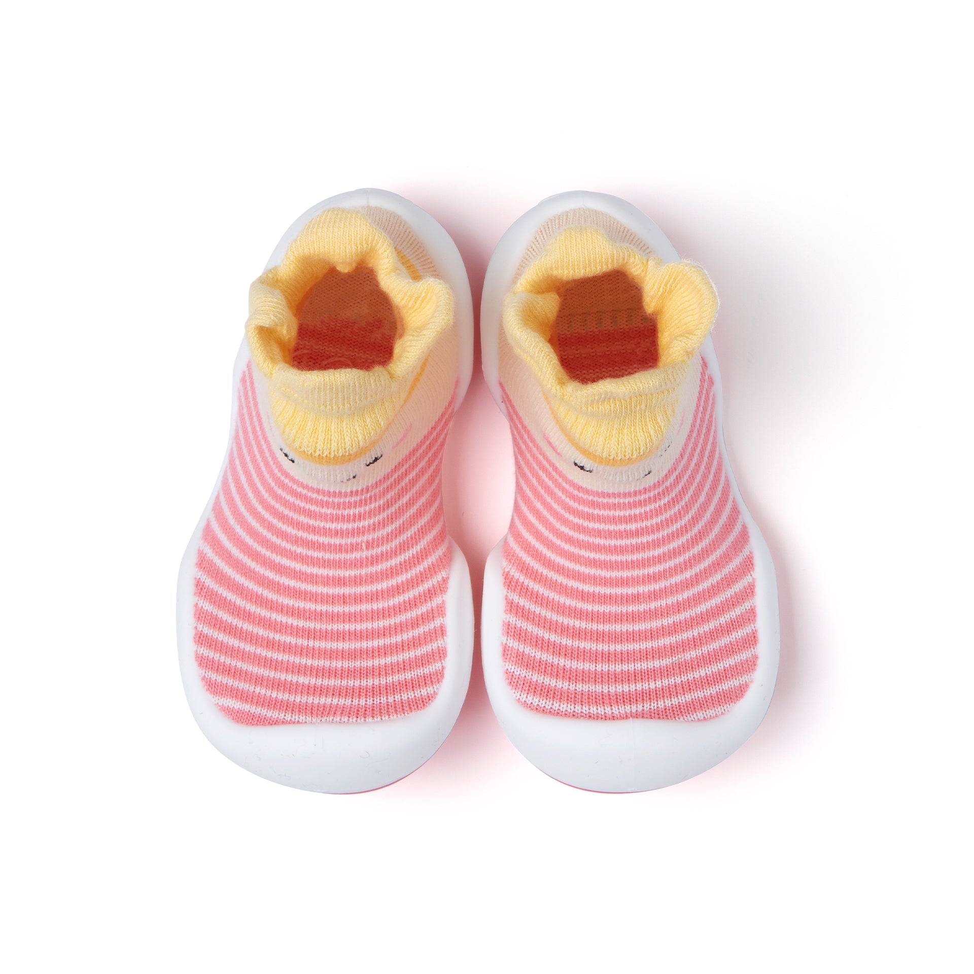 Pair of pink and white striped baby socks with yellow cuffs.