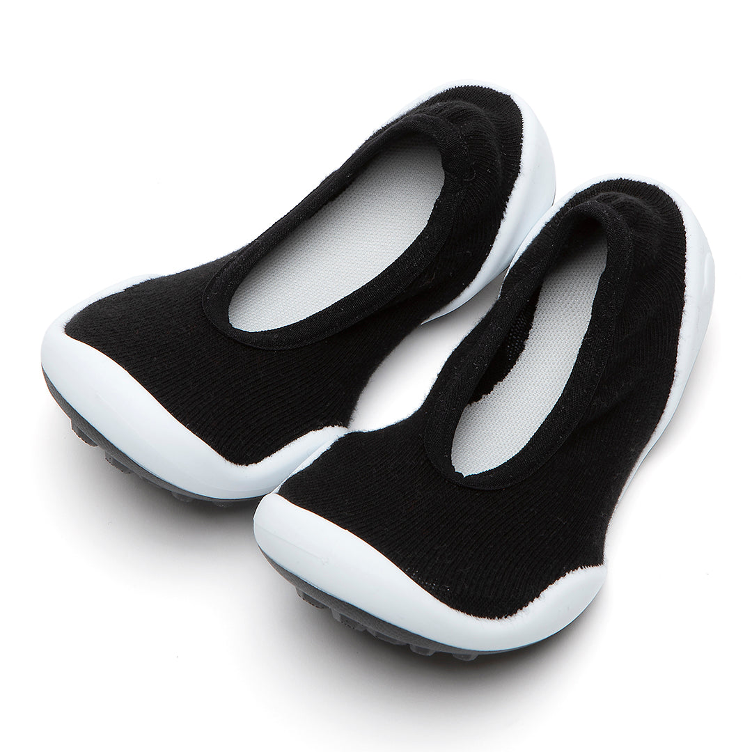Black and white sock-like shoes.
