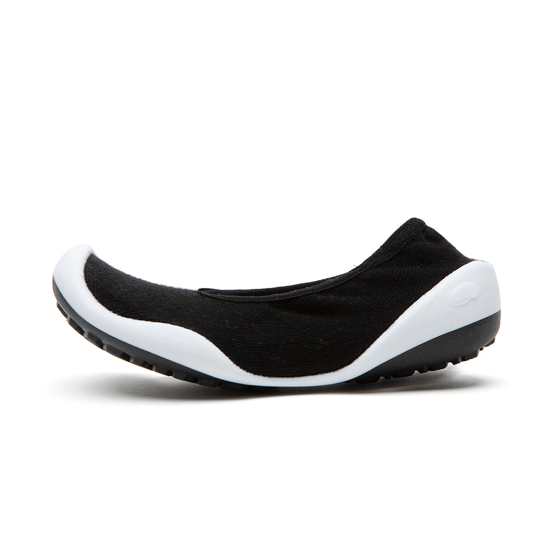 Black slip-on shoe with white sole.