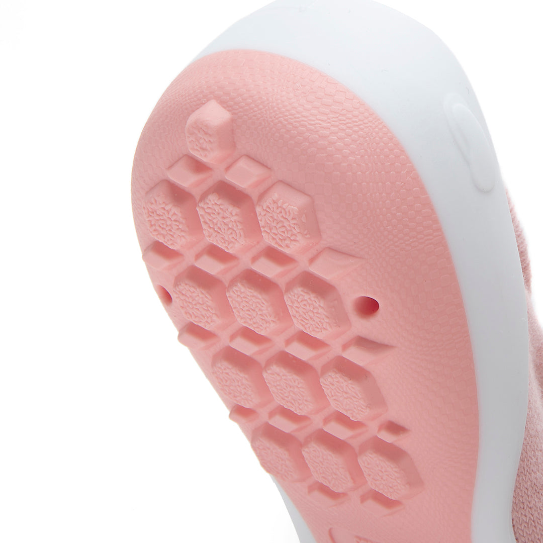 Close-up of a pink and white shoe sole.