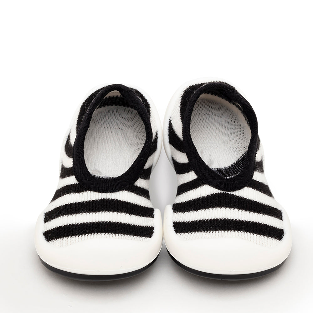 Pair of black and white striped baby shoes.