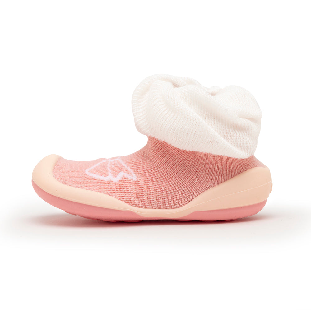 Pink slipper sock shoe with white cuff.