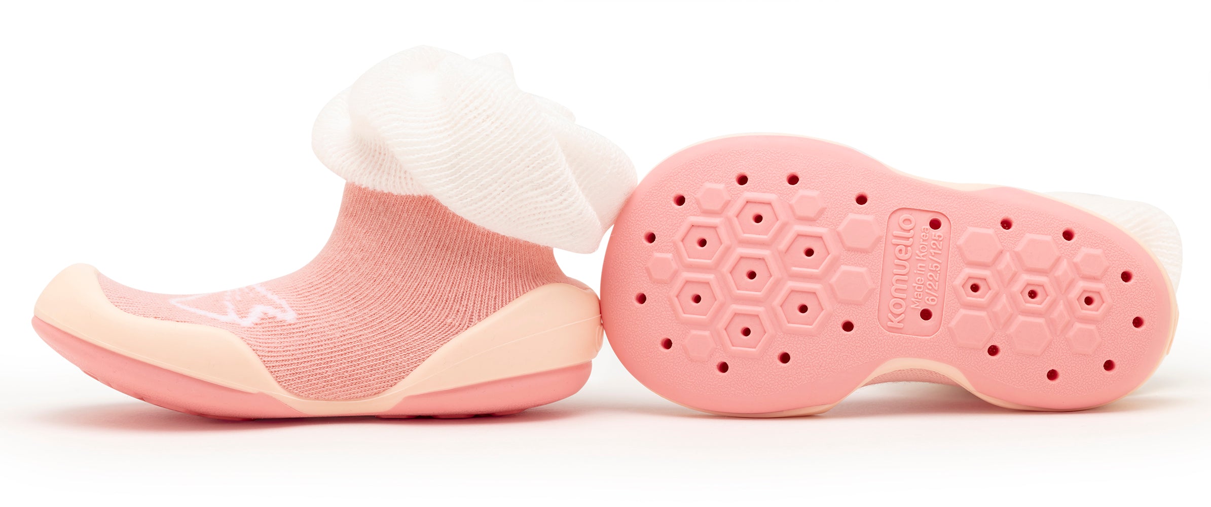 Pair of pink baby slipper shoes with white sock cuffs.