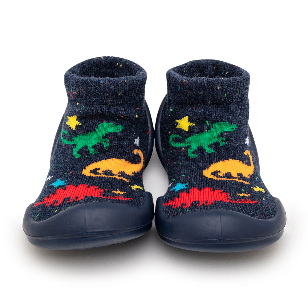 A pair of toddler shoe socks with dinosaur and star patterns.