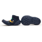Pair of navy blue sock-shoes with dinosaur pattern.