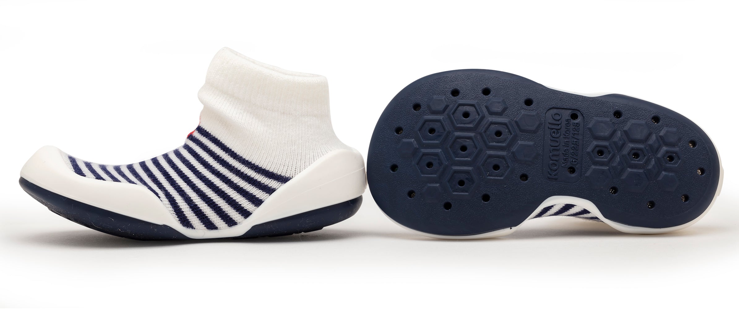 Child's striped sock-shoe with dark blue soles.