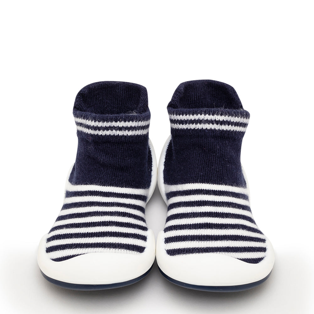 Pair of blue and white striped baby sock shoes.