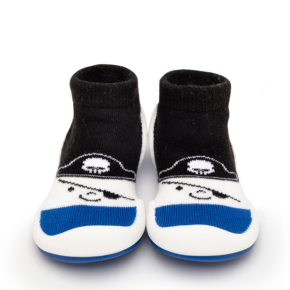 A pair of baby socks with a pirate design on the front.