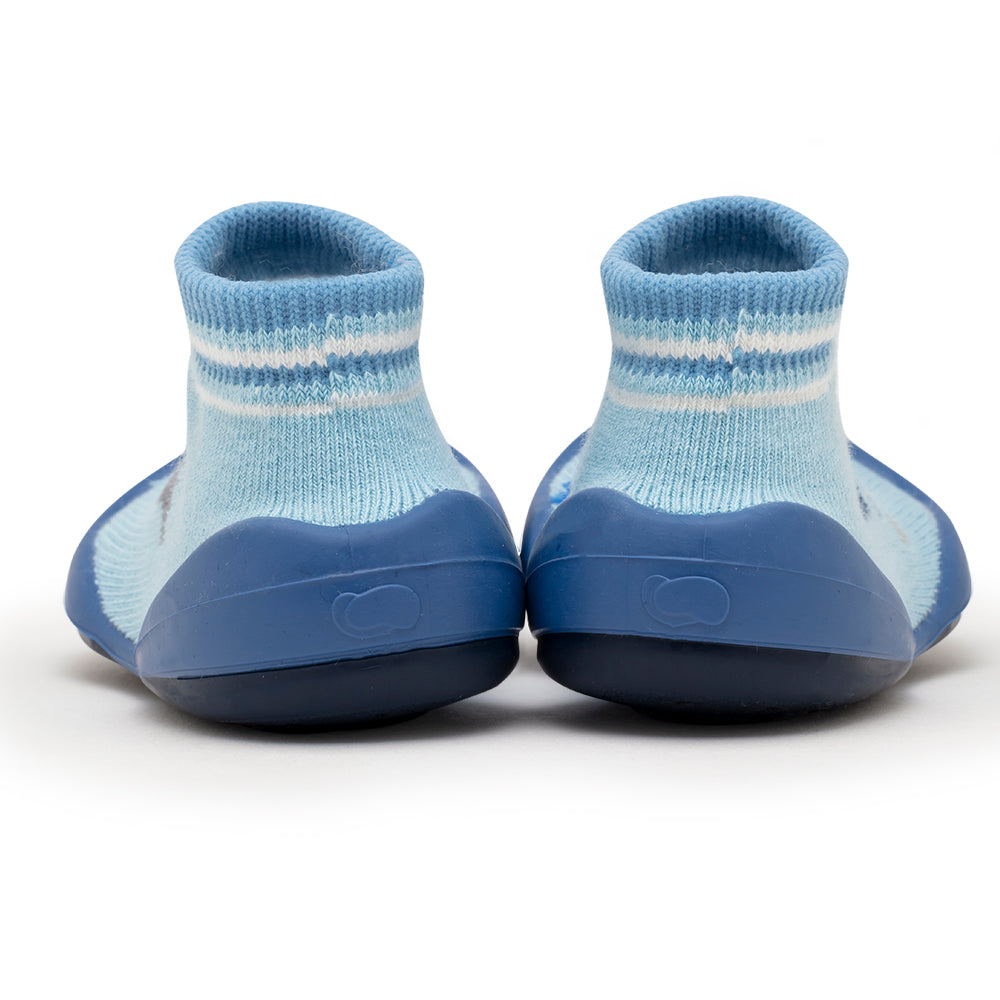 Back of blue and white baby shoe socks.