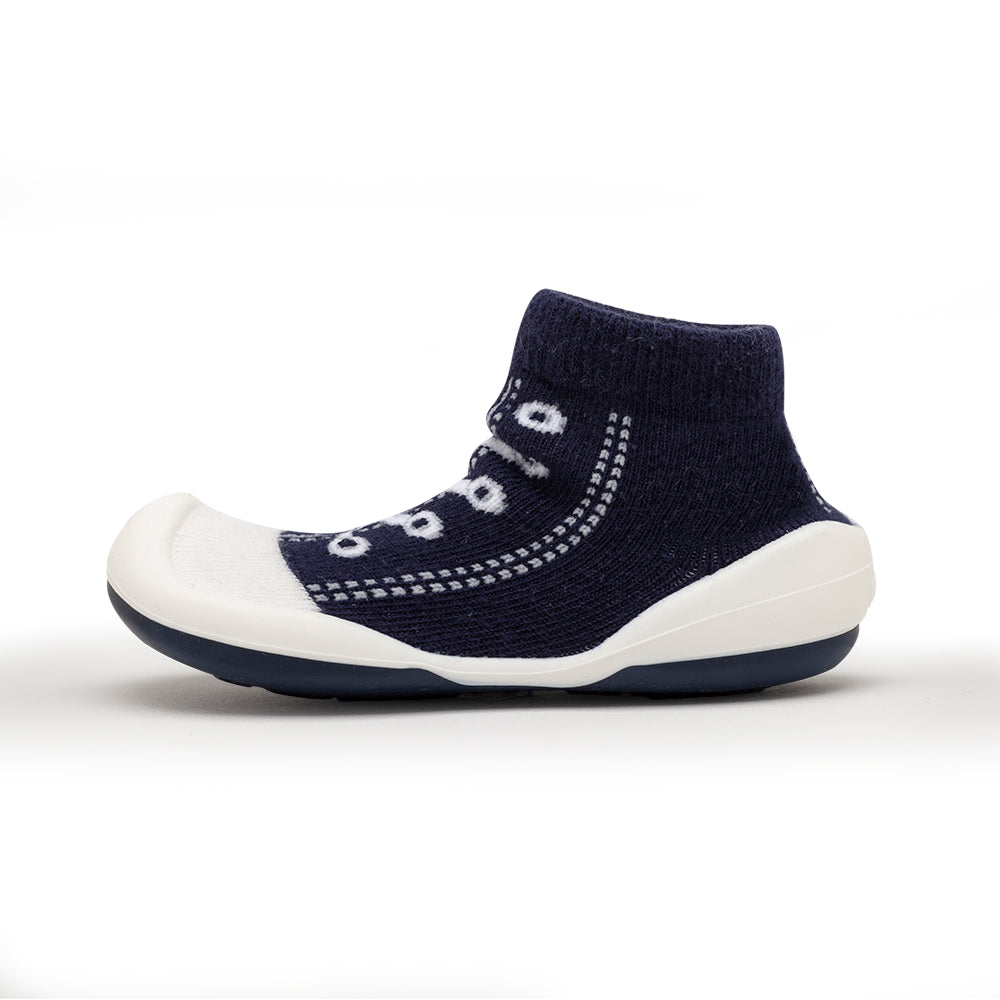 Dark blue sock-shoe with white sole.