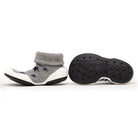 Gray baby shoe with blue stars and black sole.