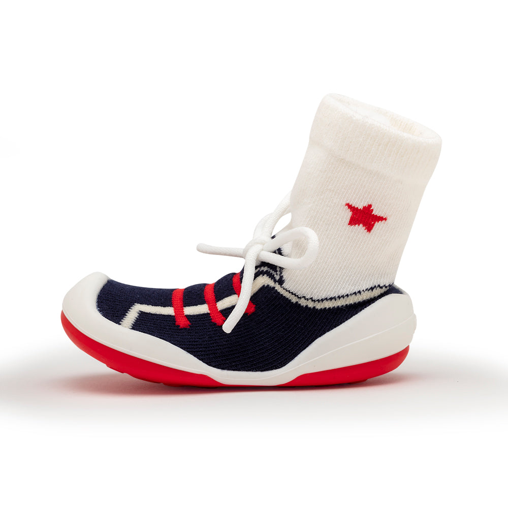 Sock-shoe with red, white, and blue accents.