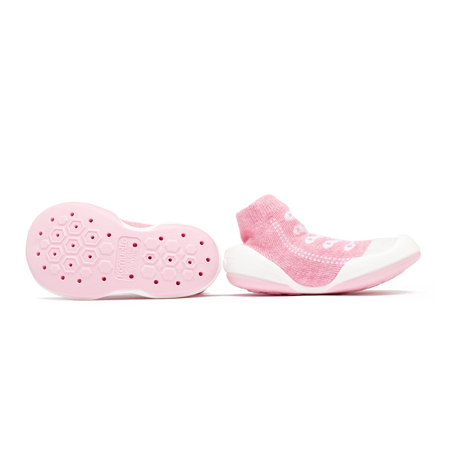 Pair of pink baby sock shoes with white soles.