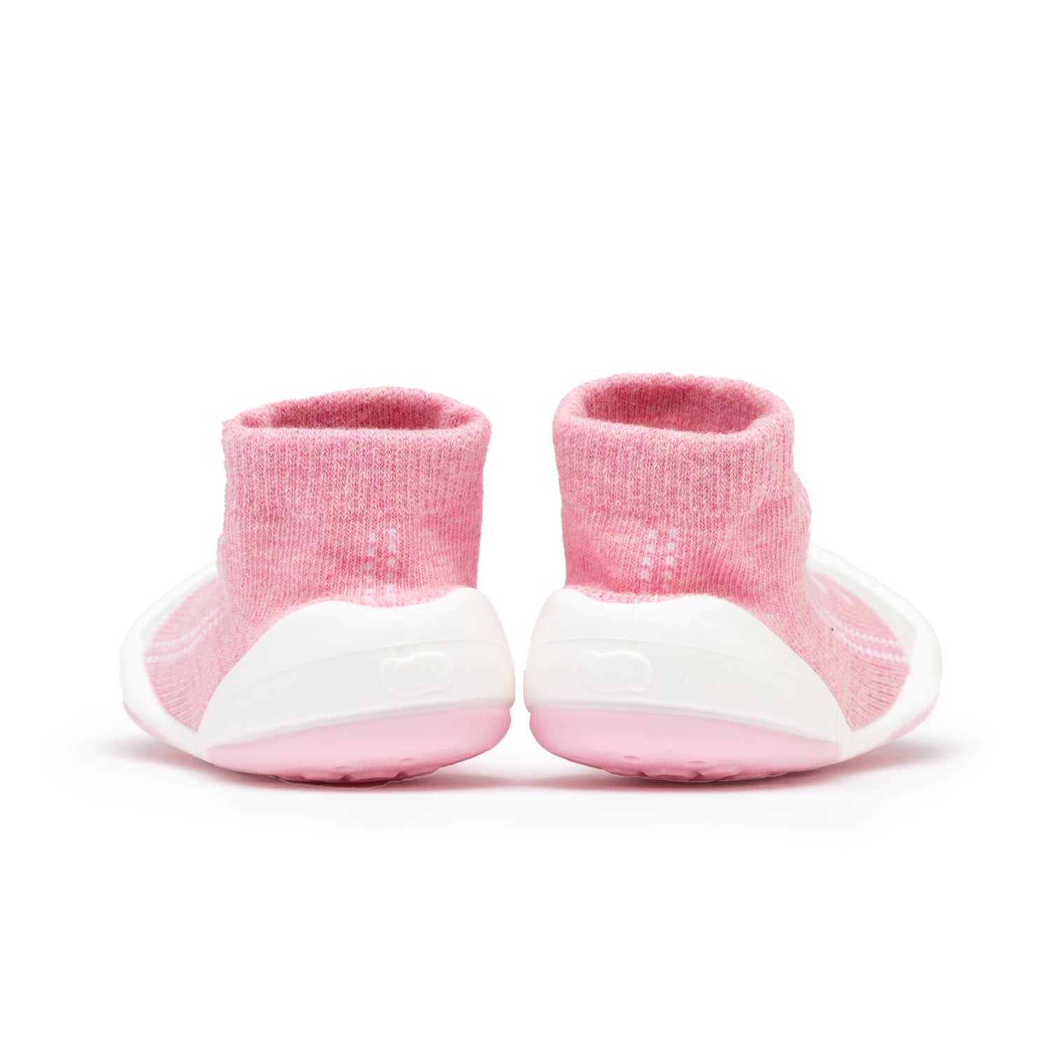 Pink sock baby shoes with white soles, back view.
