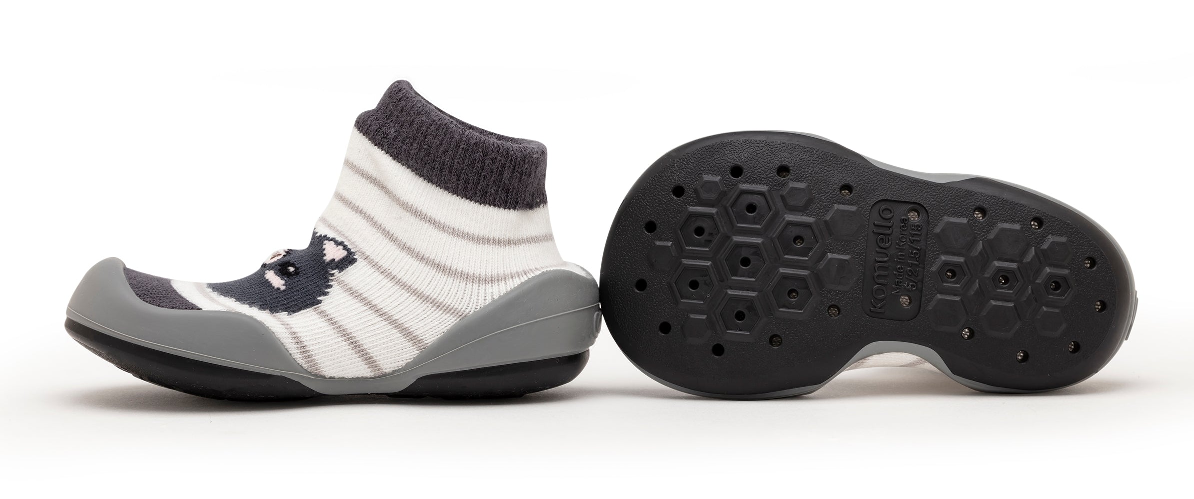 Baby sock shoes with gray accents and striped pattern.