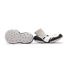 Two baby shoes with sock uppers, one showing the sole.