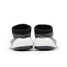Two gray and black baby sock shoes.