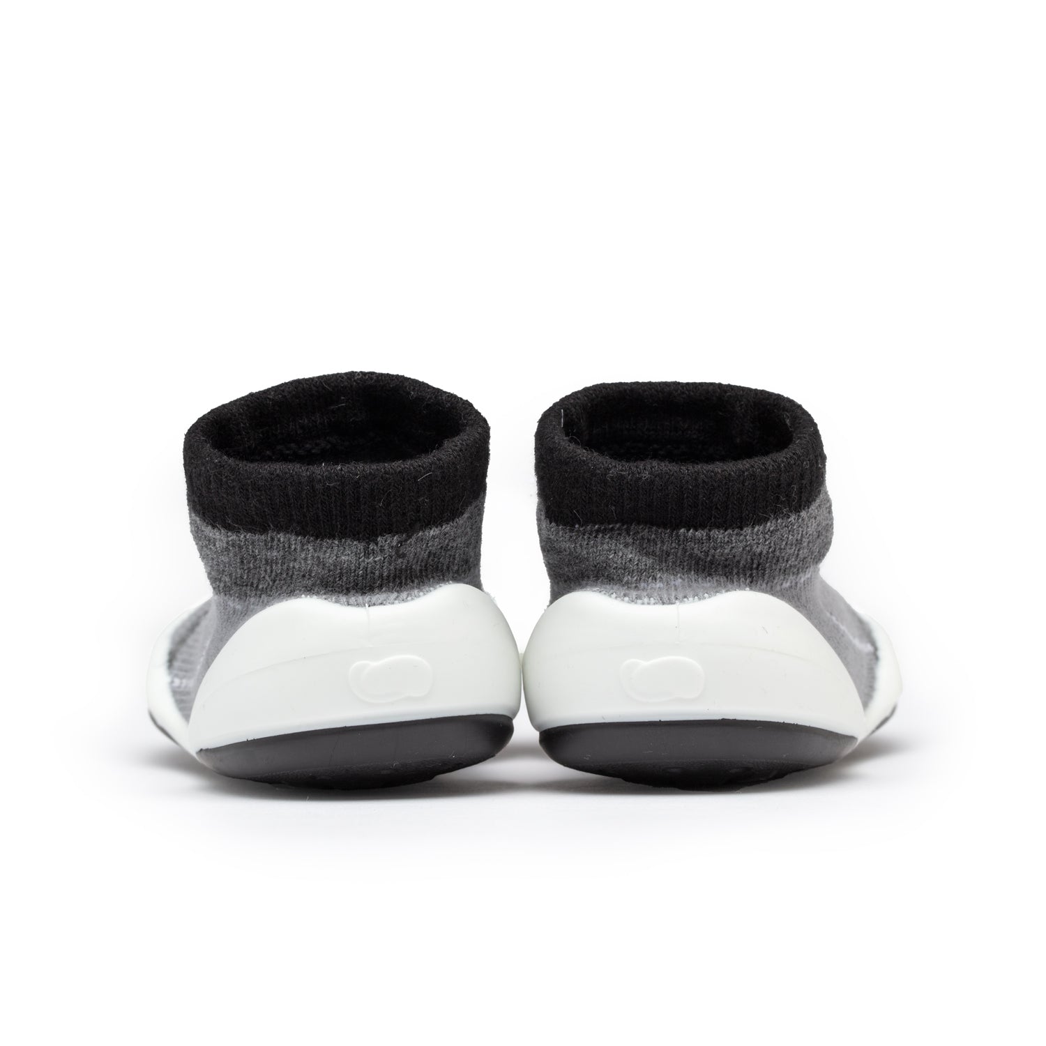 Two gray and black baby sock shoes.