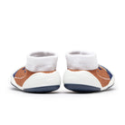 Two baby shoes with white socks and brown and blue patterned uppers, viewed from the back, against a white background.