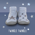 Pair of light blue sock shoes with dark gray stars.