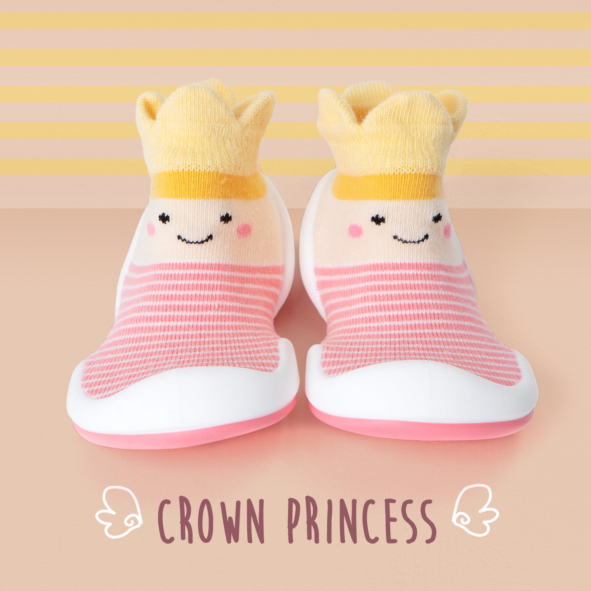 Two pink and yellow baby sock shoes with crowns.